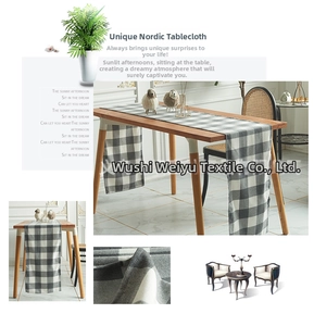 Detail view of grey and white checkered Nordic table runner with cotton linen texture