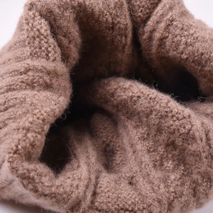 Brown knit cable beanie for women with thick textured wool pattern and ribbed cuff