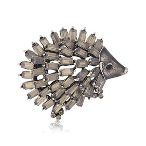 Detail of vintage hedgehog brooch with dark metal and rectangle smoky crystals