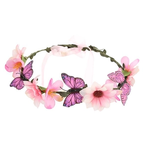 Close-up of pink silk flowers and purple butterflies on a floral bridal headband