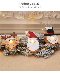 Glow-in-the-dark Christmas wooden ornaments with reindeer, Santa and snowman designs