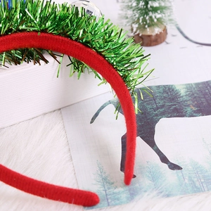 Christmas headband with red velvet and green tinsel in a festive holiday scene