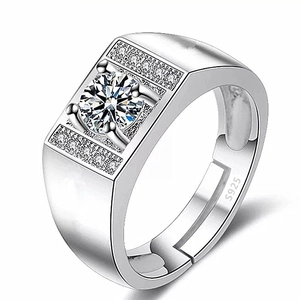 Macro shot of S925 sterling silver men's ring with four-claw set sparkling round stone