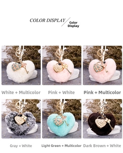 Variety of plush heart-shaped keychains with cat-eye stone charms in six colors