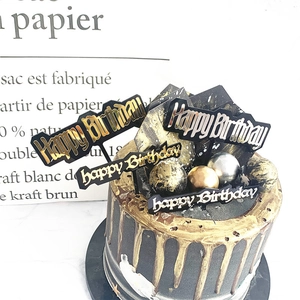 Black and gold acrylic happy birthday cake topper set for elegant party dessert decoration.