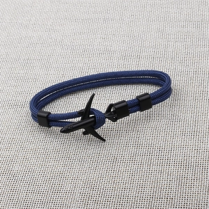 Close-up of blue paracord braided bracelet with black metal airplane clasp detail