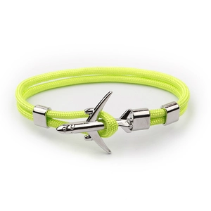 Detail of neon green woven cord bracelet with silver airplane metal clasp and slides