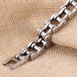 Macro detail of silver stainless steel 12mm bike chain link bracelet with polished finish