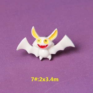 Macro view of cartoon bat resin charm with size 7 specification on purple background