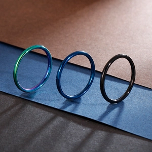 Three-piece set of minimalist stackable rings in rainbow, navy blue and black mirror finish