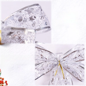 Close-up of double-layered gauze ribbon with silver star patterns and twist ties