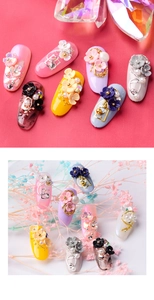 Detail of DIY floral nail art charms with resin petals, pearls and metal chains
