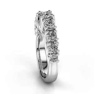 Macro view of five-stone claw setting ring with round-cut brilliant zircons on polished band