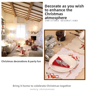 Close-up of festive Christmas gnome cutlery holders on a decorated dinner table