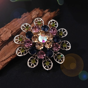 Macro shot of colorful crystal flower brooch featuring multi-color rhinestones and silver alloy