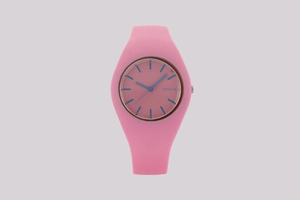 Detailed view of pink silicone watch with blue hands and Geneva logo on the dial