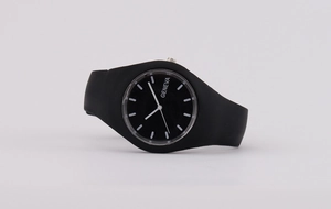 Close-up of Geneva fashion quartz watch featuring a black silicone strap and dial