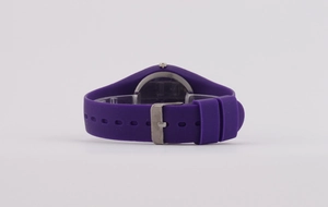 Detail of purple silicone watch strap with secure silver metal buckle closure