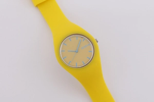 Top view of yellow Geneva quartz watch with silicone strap and blue dial details