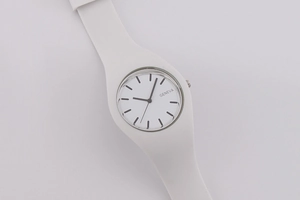 Close-up of Geneva white silicone quartz watch with silver bezel and clear dial