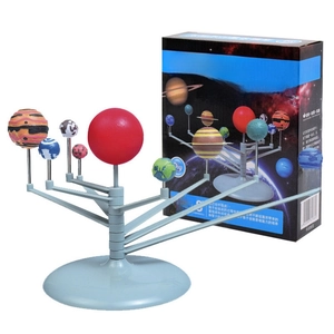 Detail view of DIY Solar System planetarium kit with colorful planets and retail packaging