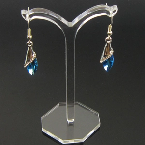 Blue water-drop crystal earrings on Y-shaped acrylic display with silver accents