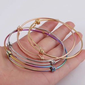 Set of four 1.8mm adjustable stainless steel wire bangles in gold, silver and rainbow finish