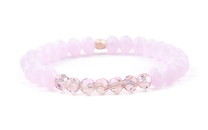 Close-up of pink frosted beads and faceted champagne crystal beads on a stretch bracelet
