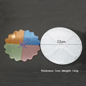 Detailed view of 23cm silicone coaster mold with four sections and wavy edge design