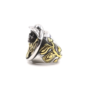 Detail of gothic skull ring with tactical helmet and gold heart ace playing card inlay