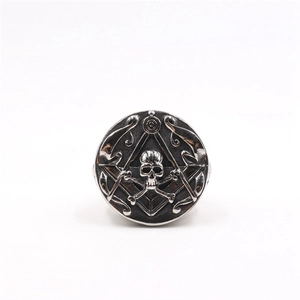 Detail of vintage stainless steel masonic skull ring with retro oxidized silver finish