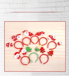 Close-up of assorted Christmas headbands with spring reindeer, Santa and snowman designs