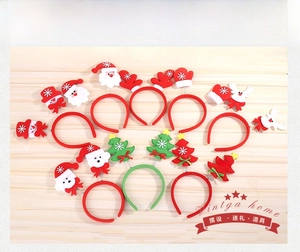Flat lay of colorful Christmas headbands with Santa, reindeer, and tree designs