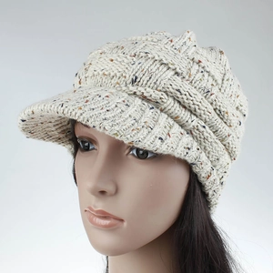 Close-up of cable knit texture on beige nep yarn ponytail baseball cap with visor