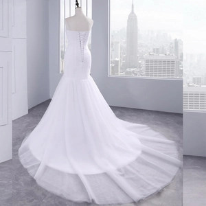 Elegant white mermaid evening gown with off-shoulder design and long luxury train