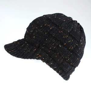 Detailed close-up of thick black knit baseball cap with colorful speckled yarn and brim
