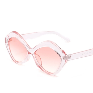 Pink transparent geometric diamond sunglasses with gradient lenses in a retro style
