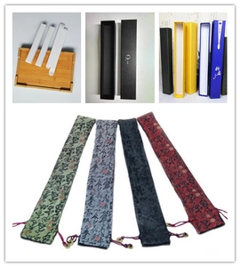 Collage of rigid minimalist pencil cases and traditional Chinese calligraphy fabric pouches