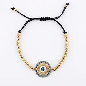 Adjustable evil eye charm bracelet with gold beads and sparkling micro-paved zircons