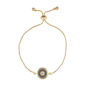 Detail view of gold evil eye bracelet with colorful pavé cubic zirconia and slide clasp