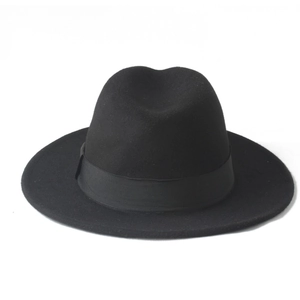 Close-up of classic black wool felt panama hat showing the texture and decorative ribbon