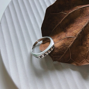 Minimalist S925 sterling silver FAITH cross open ring on white ceramic plate