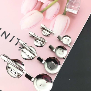 Close-up of silver metal brooch base with alligator clip for DIY craft accessories