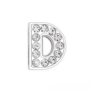 Macro shot of a 10mm chrome finish letter D slide charm with sparkling white rhinestones