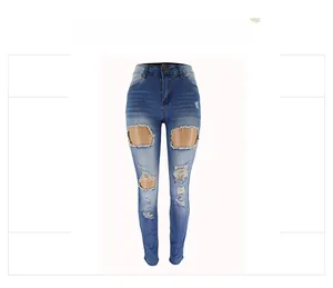 Detail show of high waisted blue skinny jeans with distressed ripped knees and frayed edges