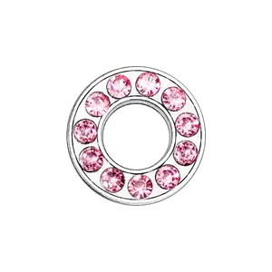 Detail of 8mm chrome ring charm featuring inlaid pink crystals in a circular setting
