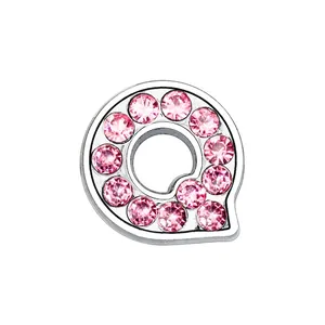 Macro view of 8mm chrome letter Q charm featuring sparkling pink rhinestones