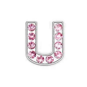 Detail of pink rhinestone letter U charm with polished silver chrome metal base