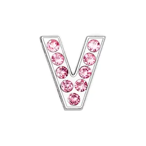 Detail showing chrome-finished letter V pendant with sparkling pink crystal inlay