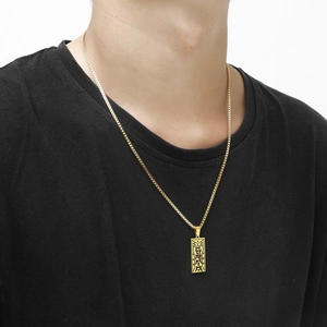 Men's hip-hop gold stainless steel Taoist rune pendant necklace on a male model